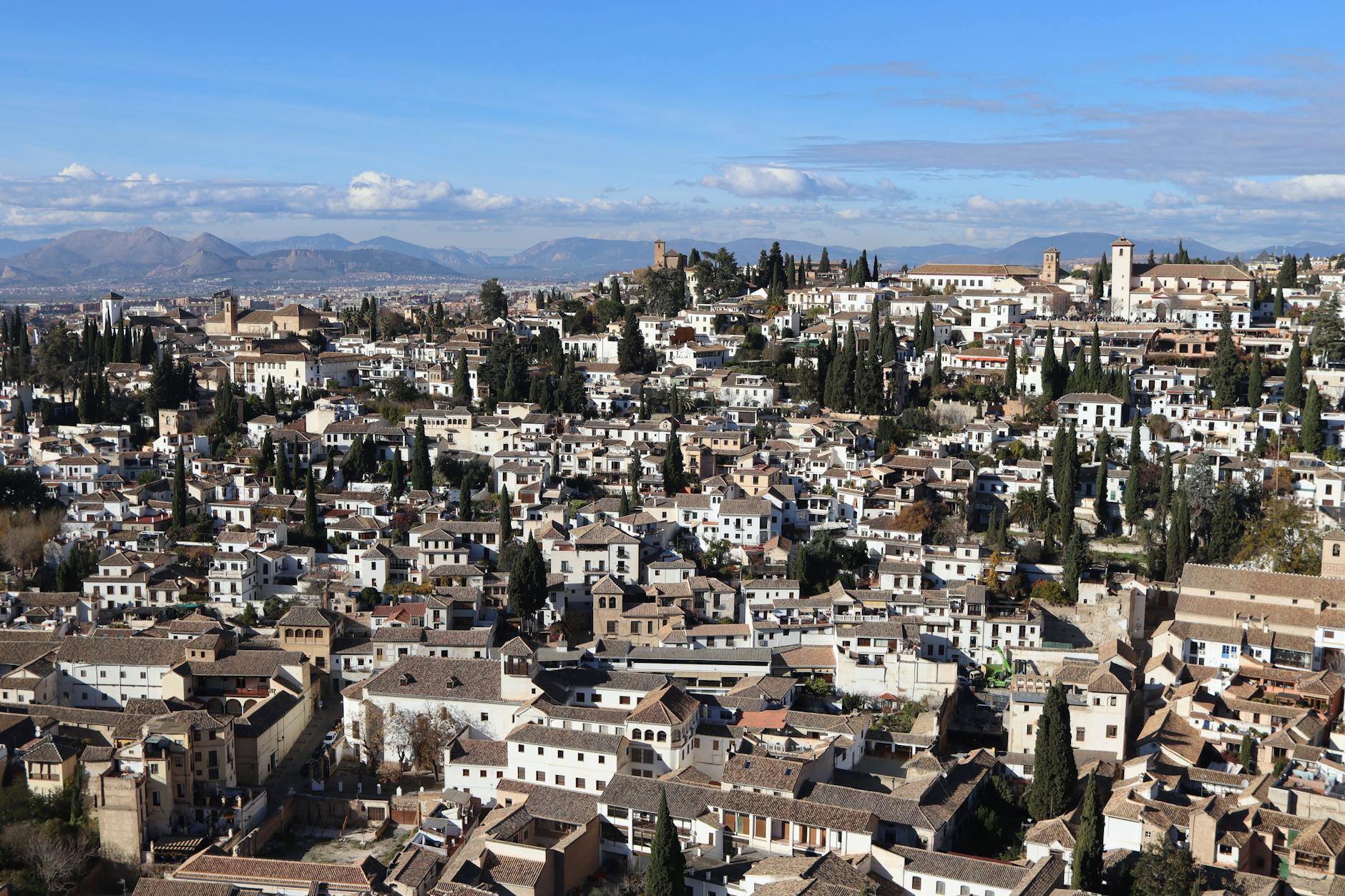 Aerial view of the historic Albaicín district in Granada, Spain, showcasing intricate architecture.