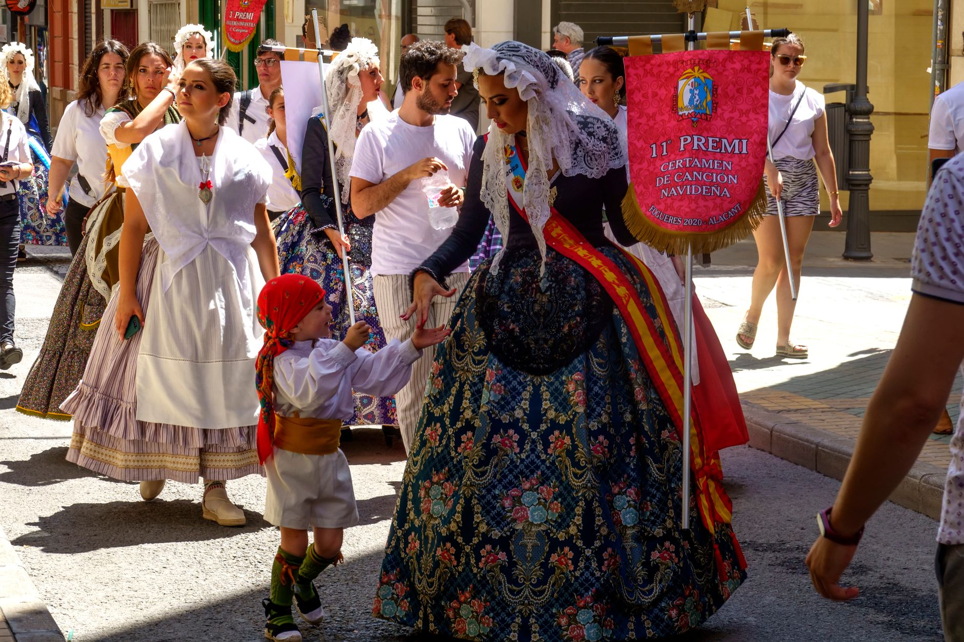 Colorful parade with traditional costumes in Alicante, celebrating Spanish culture and folklore.