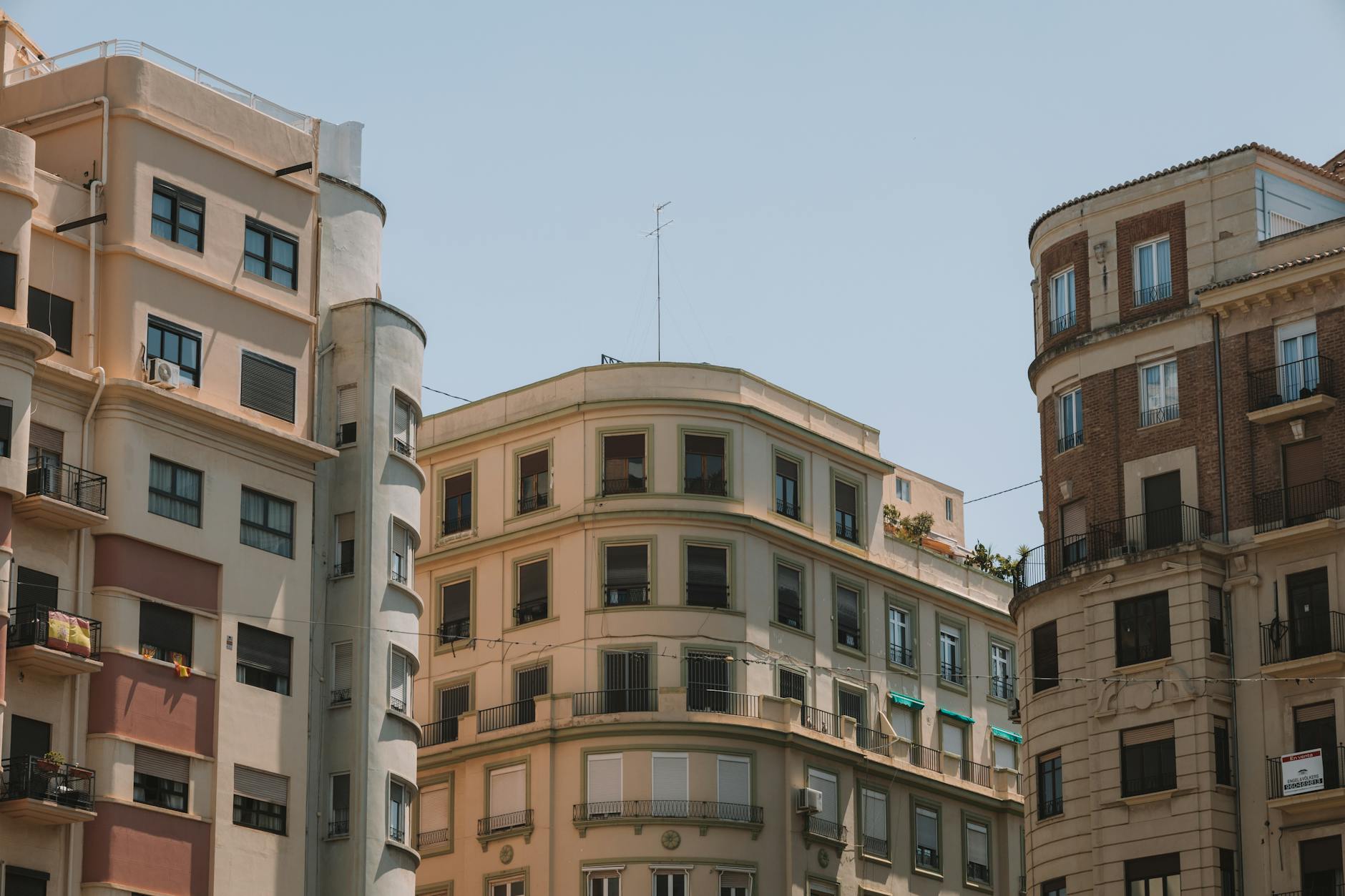 Explore the traditional architecture and sunny facades of Valencia&rsquo;s charming apartment buildings.