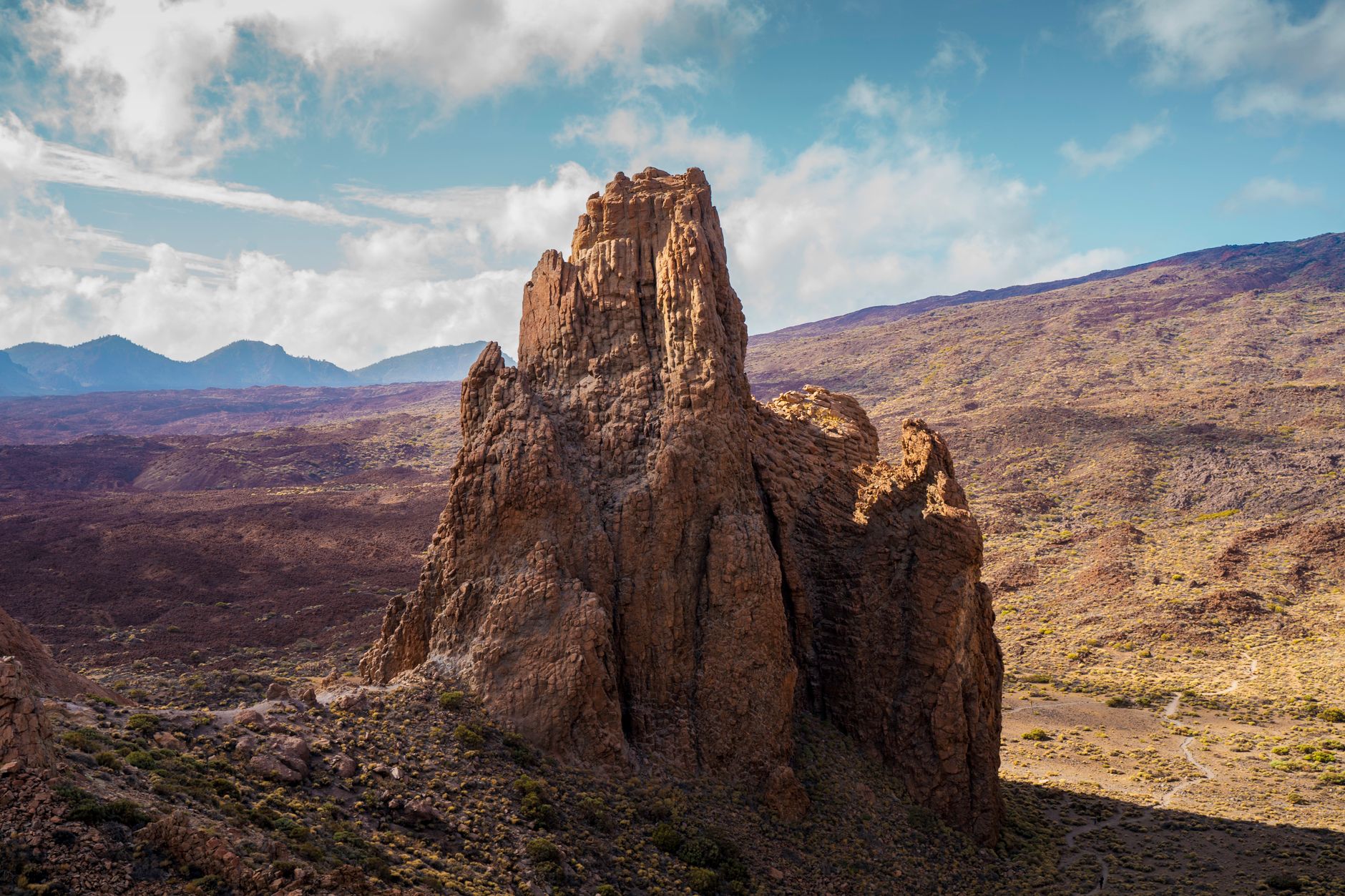 Breathtaking view of a volcanic rock formation under a clear blue sky in Teide National Park, Tenerife.