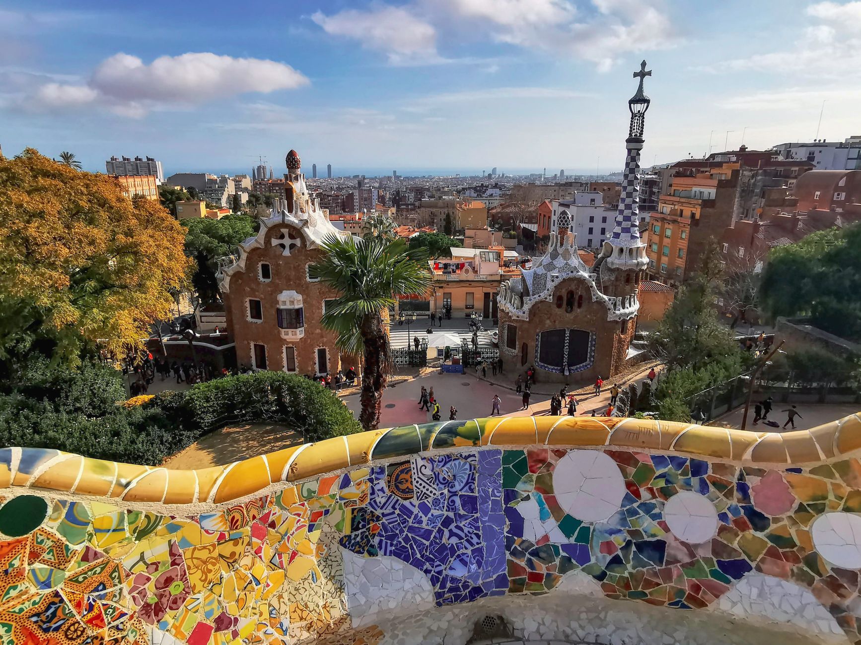 A colorful mosaic and architectural view of Park Güell in Barcelona, showcasing Gaudí&rsquo;s unique style.