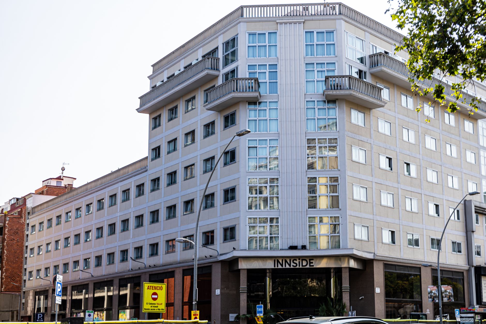 Corner view of a modern hotel building in Barcelona, showcasing urban architecture.